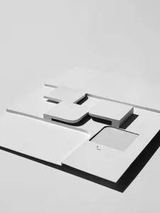 Modern interior design paper plan featuring geometric shapes and blocks.