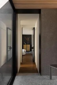 Interior space featuring modern design elements with wooden accents, stone finishes, and metal details.