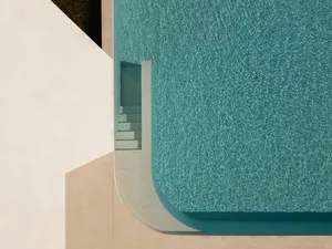 Modern pool with concrete stairs and blue water