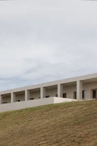 A modern architectural structure with a minimalist design, constructed of concrete.