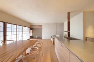 A modern residential kitchen featuring wood elements and a cozy atmosphere.