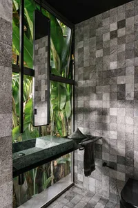 A modern bathroom with industrial design elements and a granite interior.