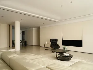 Modern, minimalist living room with a light color palette and sleek, simple design.
