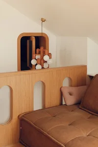 Modern interior design featuring leather seating and wooden walls
