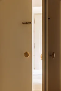 Modern minimalist interior with brass door handles
