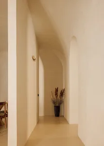 A modern hallway with concrete walls and minimalistic design.