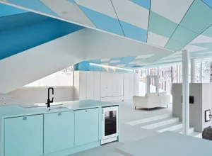 Modern, minimalist residential kitchen with concrete and glass features.