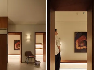 Modern residential interior with walnut accents, showcasing well-designed lighting features.