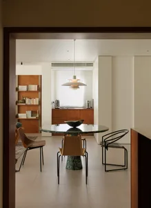 A modern residential interior featuring a marble and concrete design