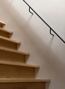 Modern wooden staircase featuring sleek, minimalist design elements.