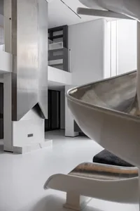 Contemporary living room with metallic and glass elements