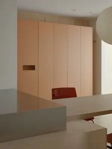 A modern office interior featuring sleek minimalist furniture, contemporary lighting, and a minimalist color palette.