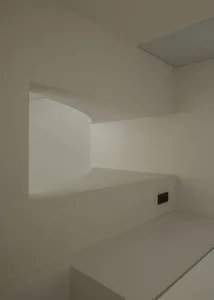 Modern minimalist interior with white plaster staircase