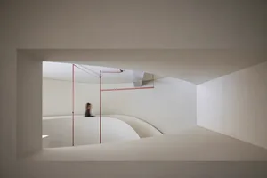 Modern staircase design with glass railings and a minimalist interior