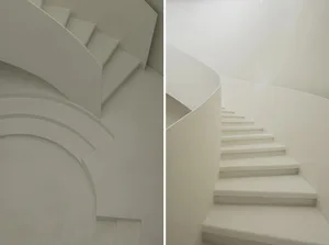 極簡設計的樓梯，採用白色水泥材質