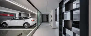 Modern interior design featuring glass and concrete architectural elements.