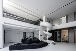 Modern residential interior design featuring sleek metal, glass, and concrete elements.