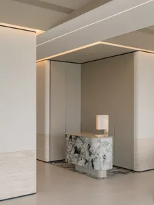 A minimalist lobby with marble accents and a sleek design.