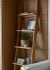 A modern interior design featuring wooden shelves, plants, and books.
