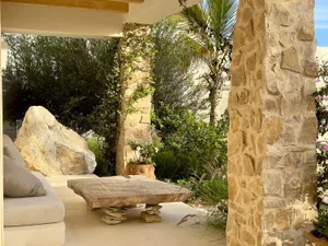 Modern living room extension featuring stone and concrete materials.