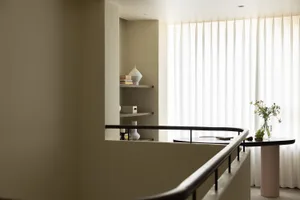A modern apartment interior featuring minimalist design elements and a clean, uncluttered space.