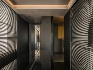Modern building corridor with metallic elements and adventure-themed design.