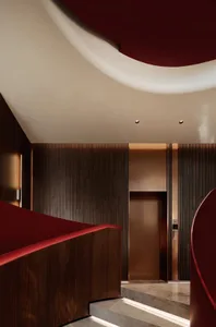 Industrial-style interior featuring dark metal paneling and minimalist design elements.