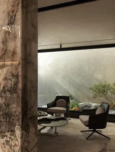 Modern living room featuring marble and glass elements