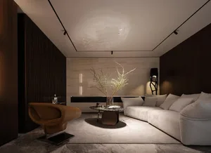 A modern living room featuring a white sofa, brown armchair, and minimalist decor with neutral-toned walls and floor.
