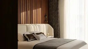 Modern minimalist bedroom with a wooden headboard panel, white bedding, and illuminated wall sconce.