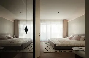 A minimalist bedroom featuring a bed with white fabric bedding and curtains, wooden floor, and large windows.