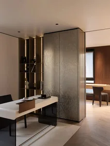 A modern office space featuring metallic finishes and sleek design elements.