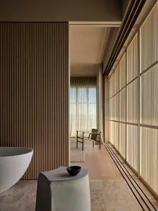 Modern minimalist bathroom designed with white marble materials.