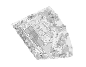 A plan view of a landscaped area with trees, plants, and pathways.