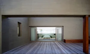 Modern minimalist residential interior designed with natural wood and metal accents.