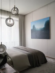 Modern minimalist bedroom with grey walls, grey bedspread, and circular glass light fixtures.