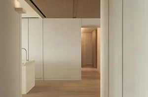 Modern interior featuring a floor with terrazzo material