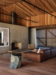 Industrial-style living room with wood elements, modern furniture, and minimalistic design.