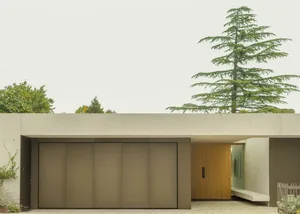 Modern design exterior of a residential home featuring a minimalist aesthetic and concrete materials.