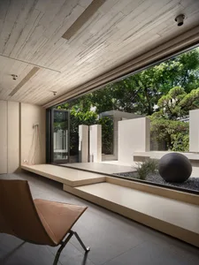 A modern residential interior with concrete elements, showcasing clean lines and minimalist design.