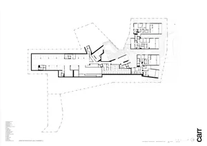 A technical 2D architectural drawing depicting a compact layout of an office building with various rooms and spaces.