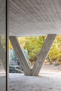 Modern installation featuring reinforced concrete structures and natural lighting.