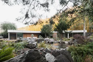Modern residential building constructed with concrete materials, featuring a minimalist design.