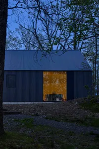 A modern residential exterior features metal siding, designed for energy efficiency and durability.