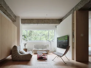 A minimalist living room with modern materials and open space