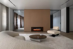 A modern living room with minimalist design, featuring a fireplace, comfortable seating, and a unique coffee table.