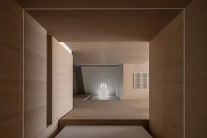 A minimalist interior design featuring wood materials in a modern space.