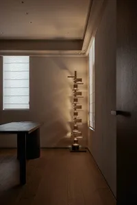 Modern residential interior design featuring minimalist aesthetics with wood and glass materials.