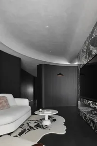 Modern living room featuring marble accents and wooden elements