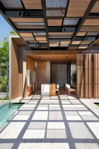 An image of a modern residential architecture featuring wood, concrete, and glass materials.